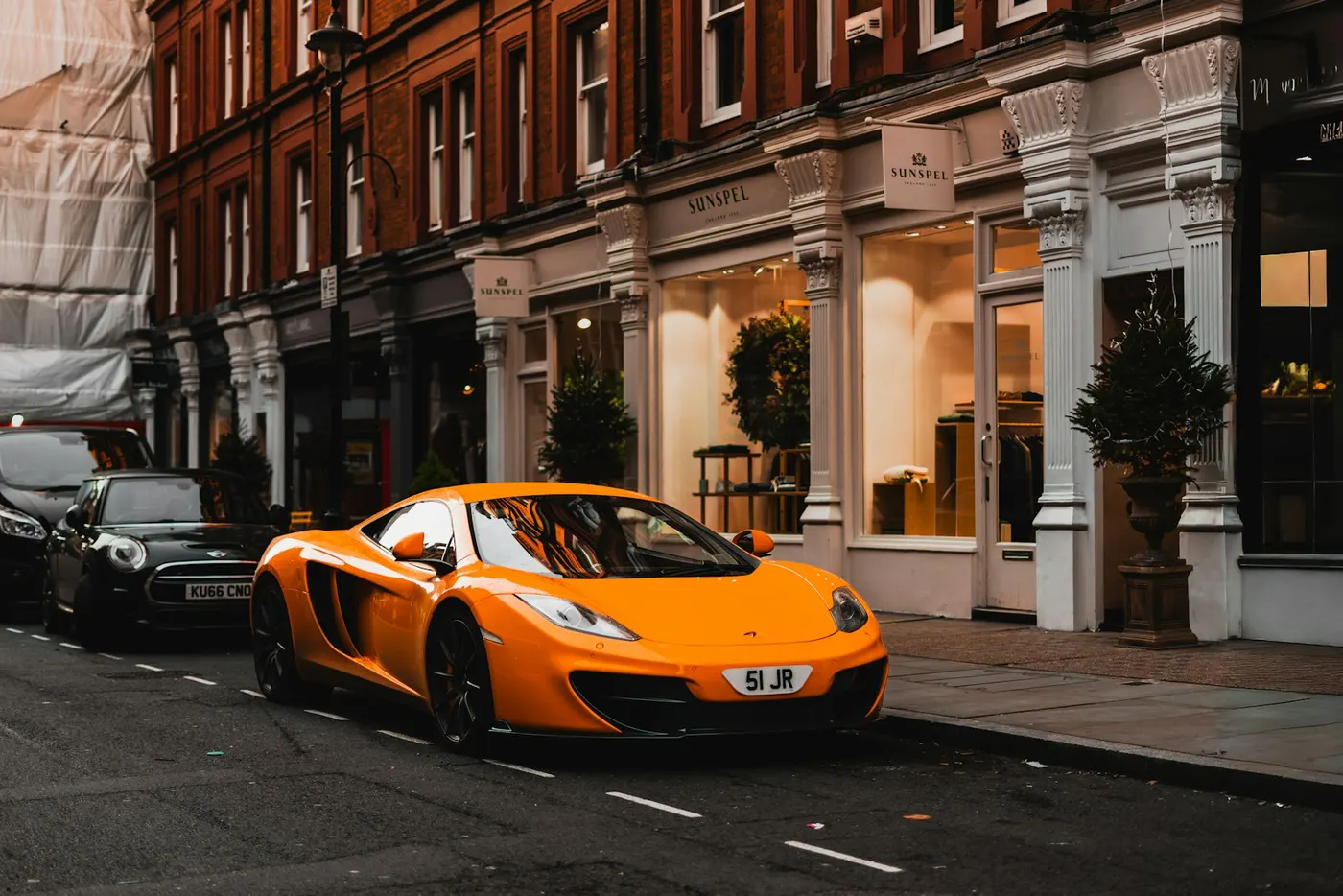 A row of independent shops on a British high street, the local businesses competing in Google's Map Pack